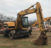 Продаем колесный экскаватор Caterpillar M315,  0,  85 м3,  2002 г.в.